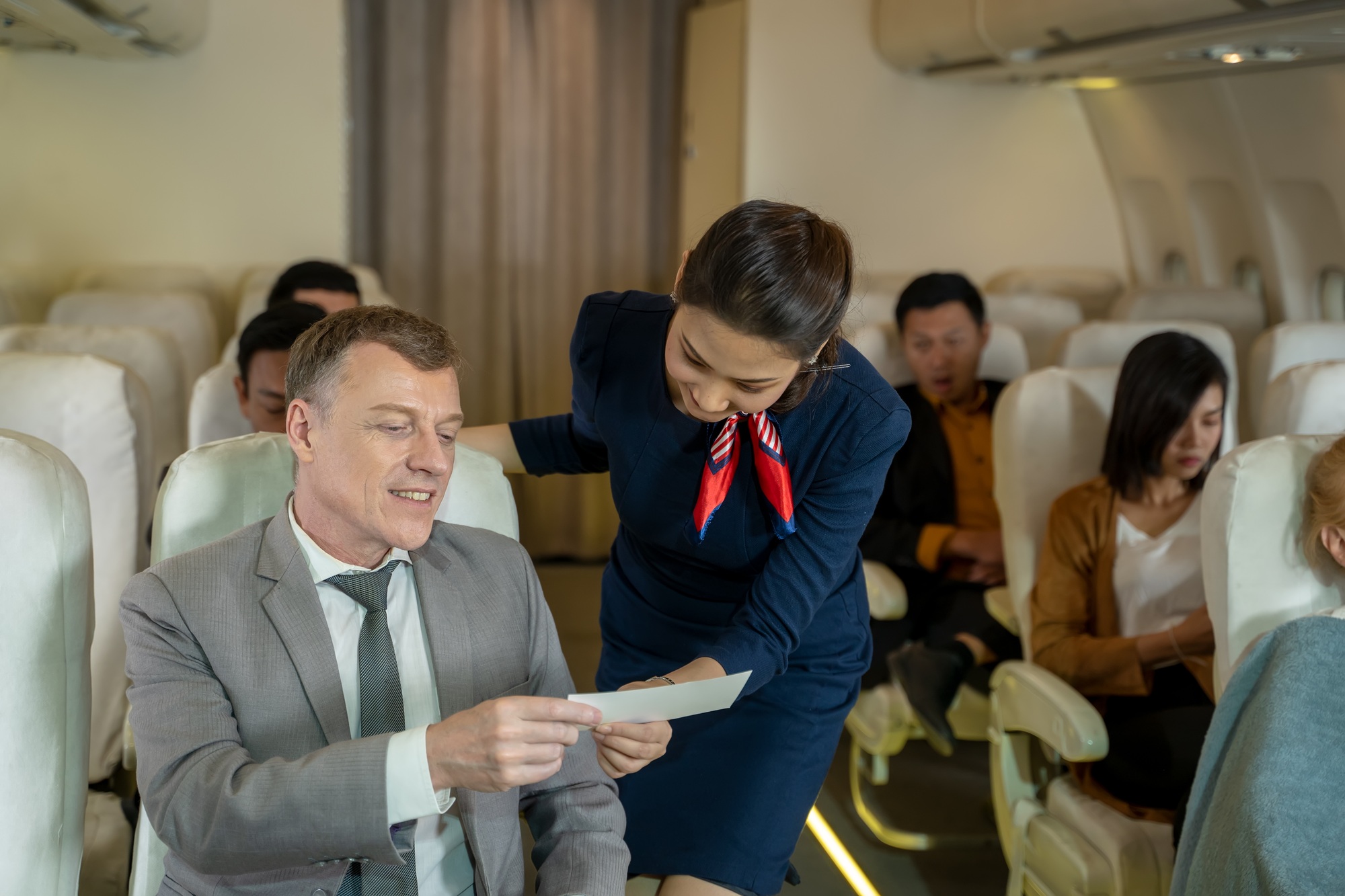 Cabin crew or air hostess takes care of passengers in planes.