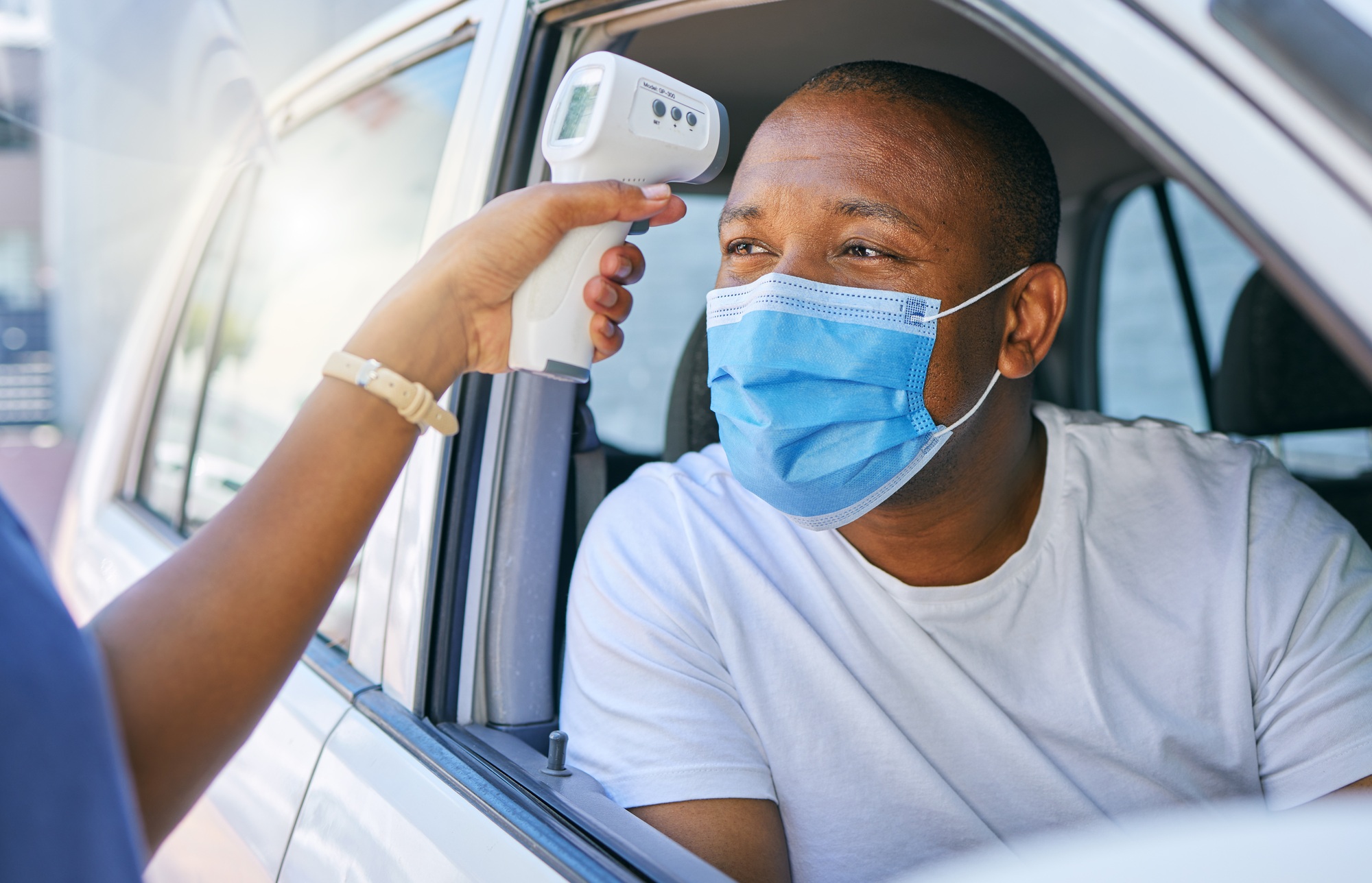 Covid, corona and infection testing site as a drive thru service station for people traveling. Afri